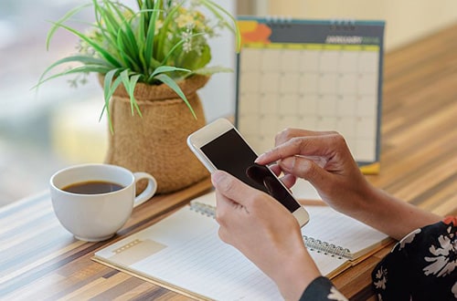 Woman setting up an appointment with an online psychologist